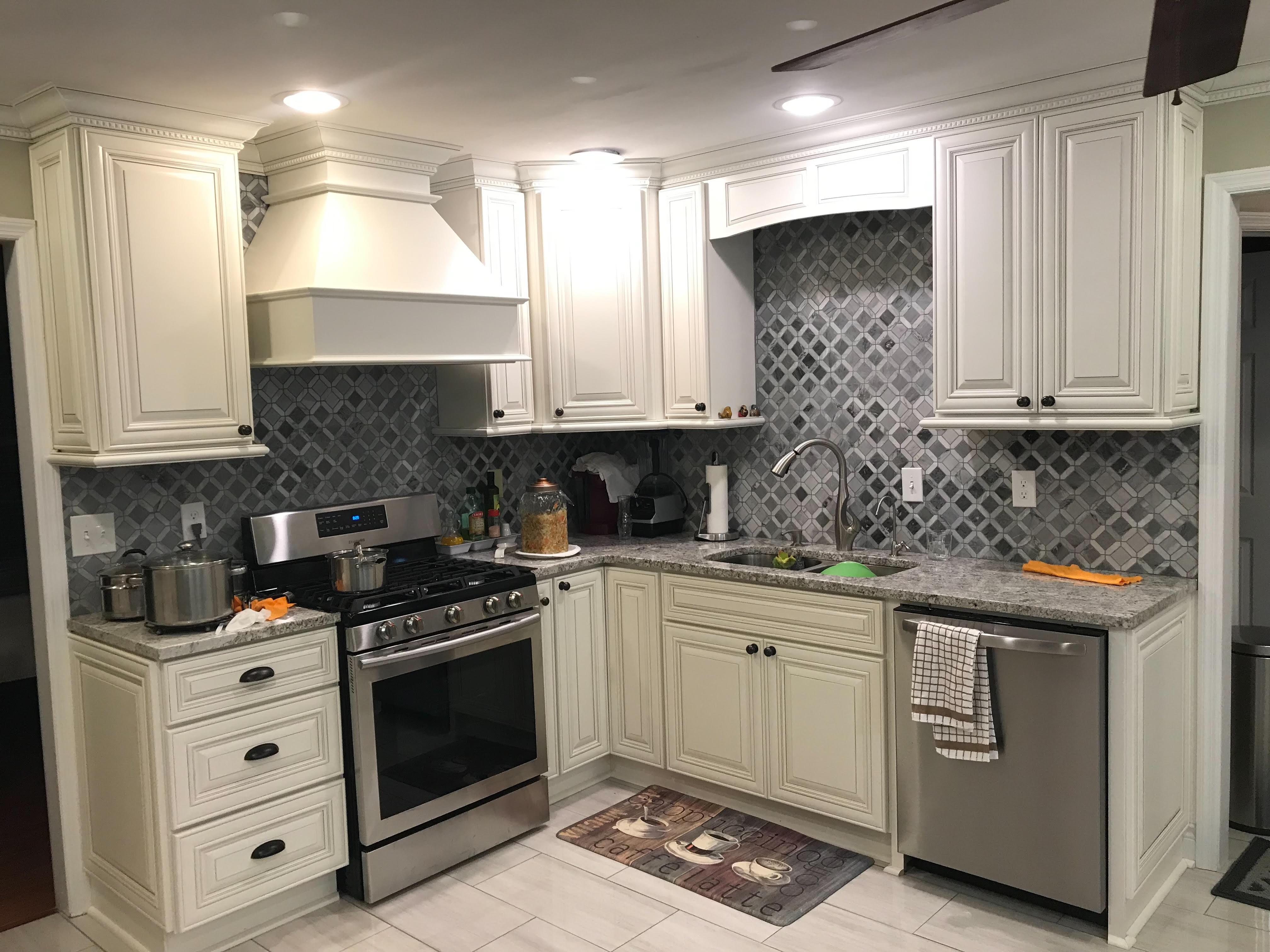 Clean kitchen with stove and sink