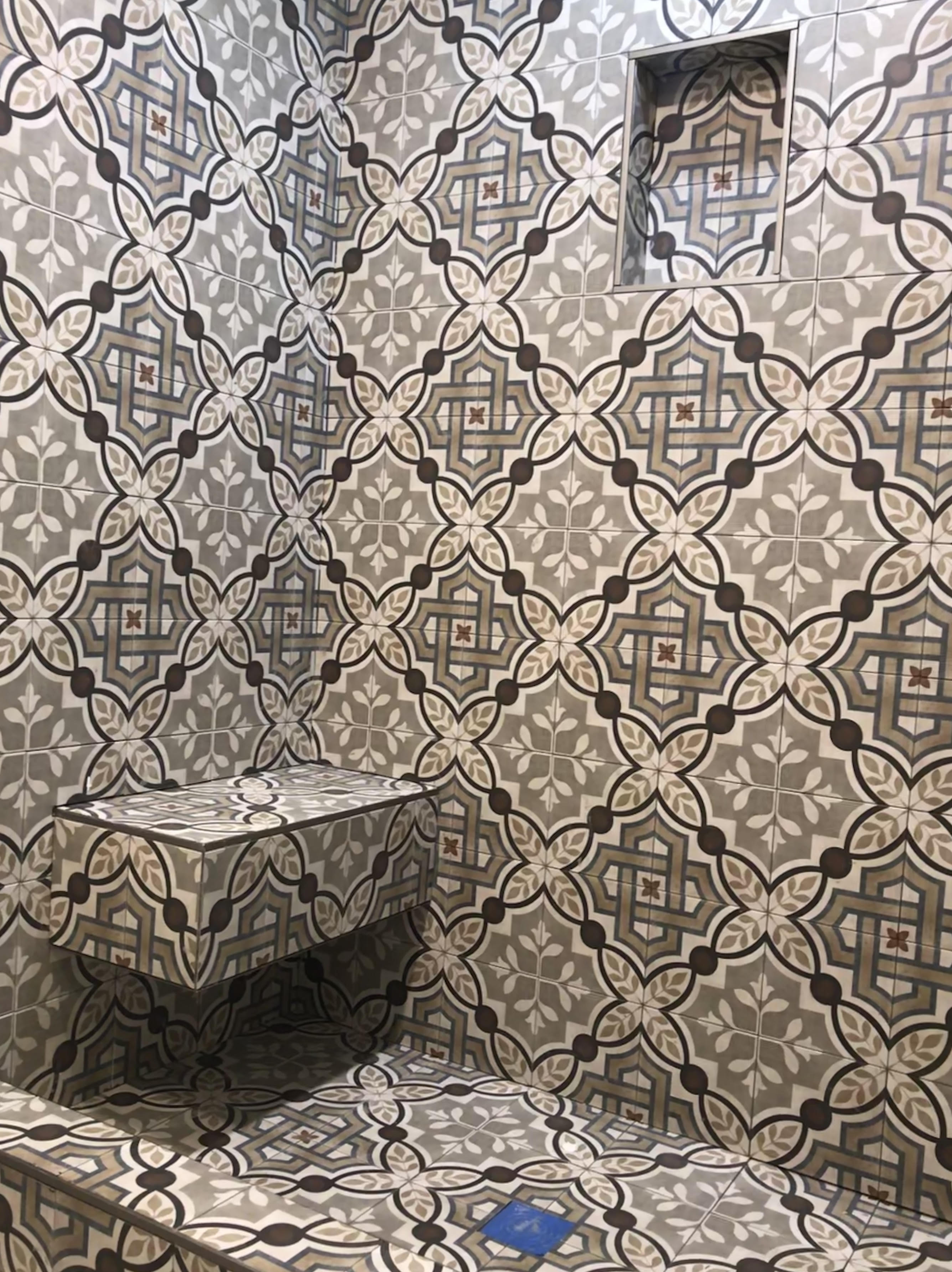 Custom shower design with seat and tiles